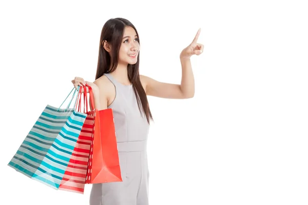 Beautiful young Asian woman with shopping bags — Stock Photo, Image