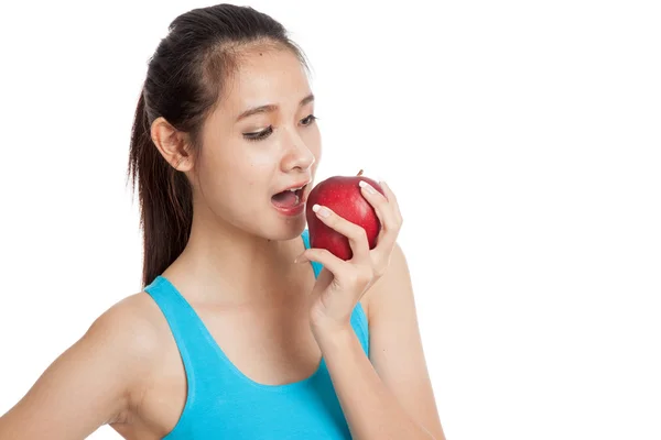 Hermosa chica sana asiática comer manzana roja — Foto de Stock