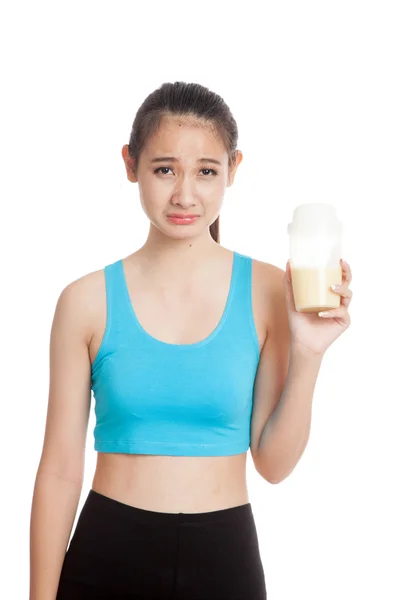 Beautiful Asian healthy girl hate whey protein — Stock Photo, Image