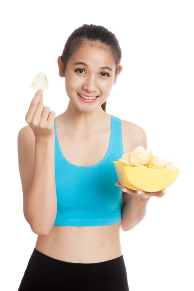 Beautiful Asian healthy girl  eat potato chips — Stock Photo, Image