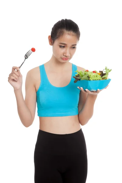 Unhappy Asian healthy girl eat salad — Stock Photo, Image