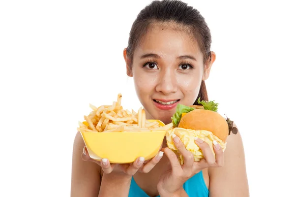 Beautiful Asian healthy girl with french fries and hamburger — Stock Photo, Image