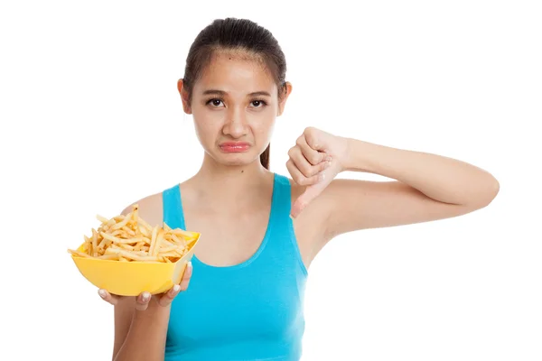 Asiatisk frisk tjej tummen ner med pommes frites — Stockfoto