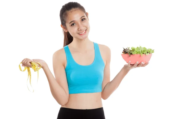 Beautiful Asian healthy girl with measuring tape and salad — Stock Photo, Image