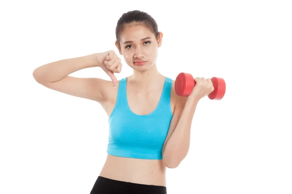 Beautiful Asian healthy girl thumbs down with dumbbell — Stock Photo, Image