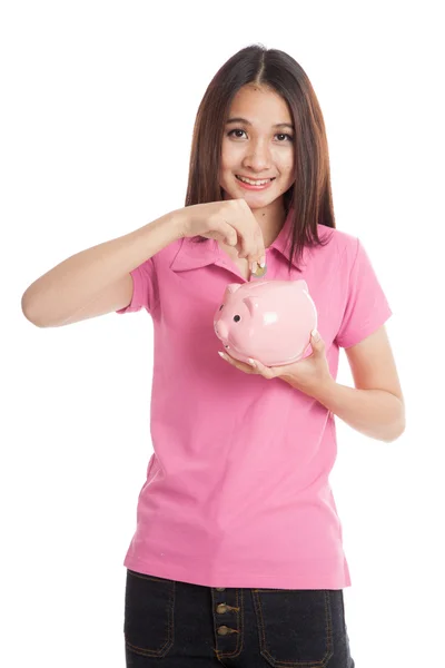 Beautiful Asian girl with piggy bank — Stock Photo, Image