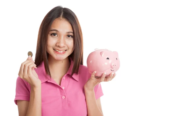 Beautiful Asian girl with piggy bank — Stock Photo, Image