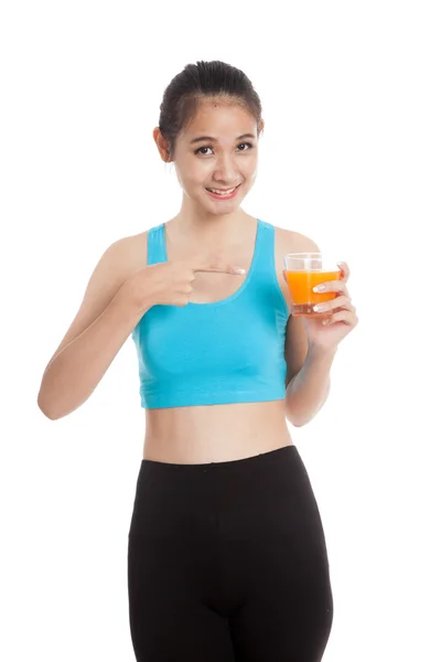 Schöne asiatische gesunde Mädchen zeigen auf Orangensaft — Stockfoto