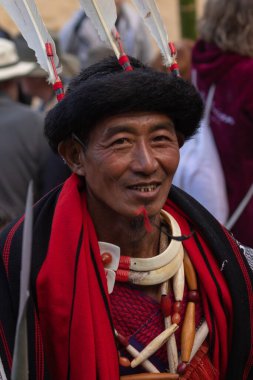 Selective focus Portrait of a Naga tribseman dressed in traditional attire at Kohima Nagaland India on 4 December 2016
