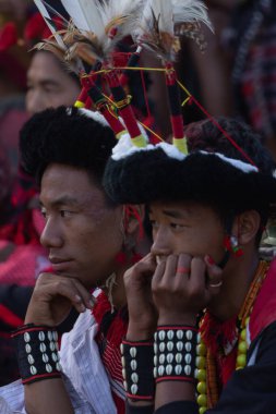 Selective focus image of a young Naga boys wearing hornbill feather headgear at Kisama Heritage village in Nagaland India on 3 December 2016