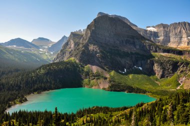 Trekking in Grinnel Lake Trail, Glacier National Park, Montana,  clipart