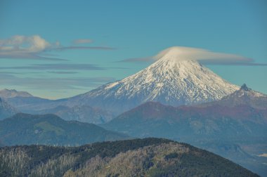 Volcan Villarrica viewed from Santuario El Cani, near Pucon, Chi clipart