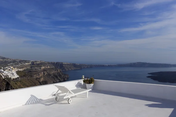 Lounge chair over Santorini caldera, Greece — Stock Photo, Image