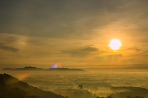 Sunrise on the morning mist — Stock Photo, Image