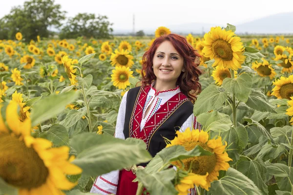 Bulgarian girl in a sunflower field — Stock Photo, Image