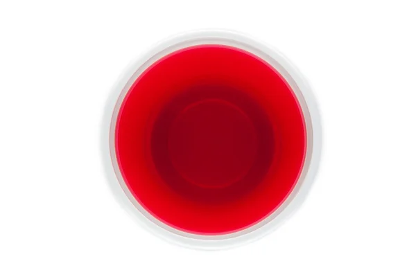 查看从上面的一个红色饮料的塑料杯 — 图库照片