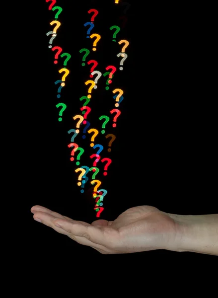 Catching question marks made of light — Stock Photo, Image