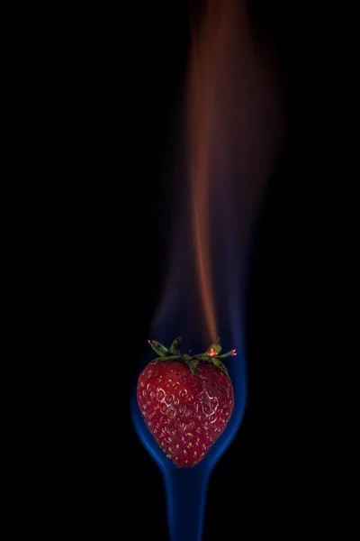 Strawberry on fire — Stock Photo, Image