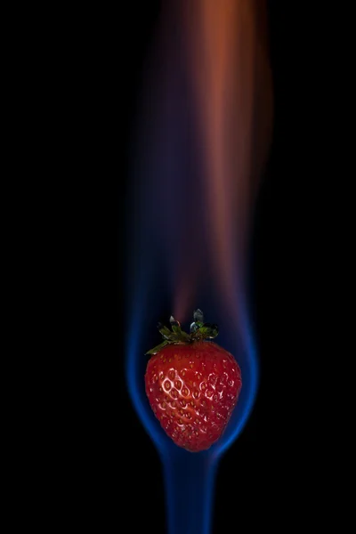 Strawberry on fire — Stock Photo, Image