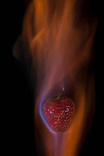 Strawberry on fire — Stock Photo, Image