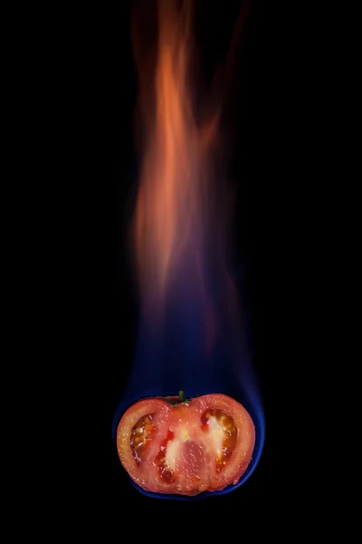 Tomato on fire — Stock Photo, Image