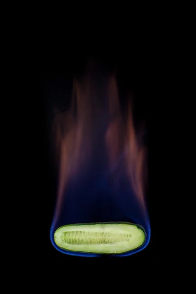 Cucumber on fire — Stock Photo, Image