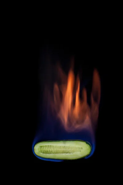 Cucumber on fire — Stock Photo, Image