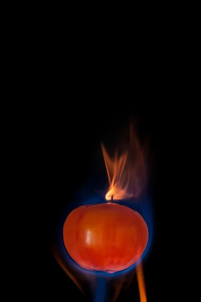 Tomato on fire — Stock Photo, Image