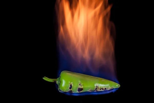 Green pepper on fire — Stock Photo, Image