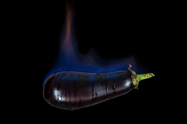 Eggplant on fire — Stock Photo, Image