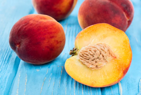 Half peach in table — Stock Photo, Image