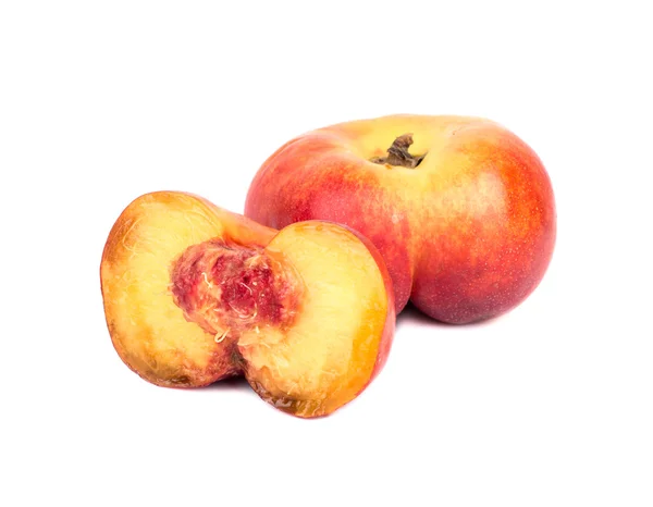 Flat peaches with half — Stock Photo, Image