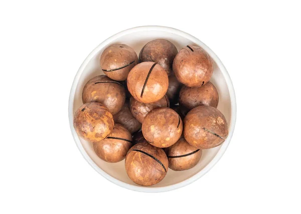 Macadamia Ořech Keramické Misce Bílém Pozadí Pohled Shora — Stock fotografie
