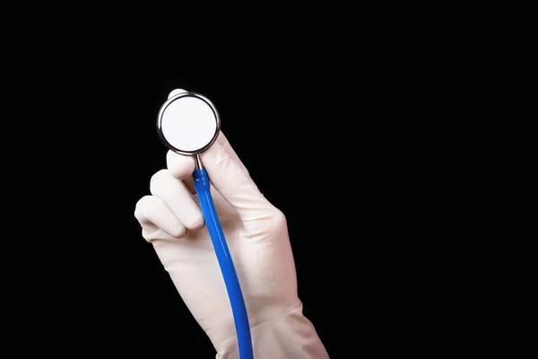 Stethoscope in hand — Stock Photo, Image