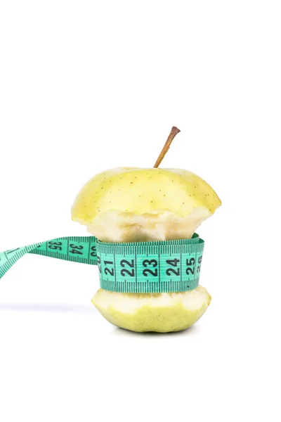 Apple core and meter — Stock Photo, Image