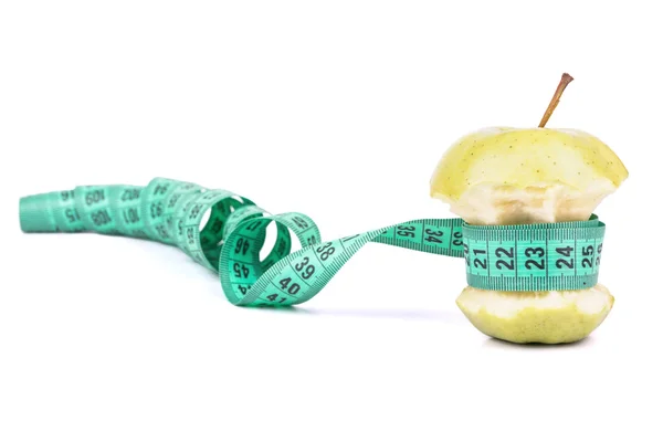 Apple core and meter — Stock Photo, Image