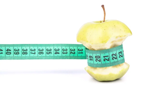 Apple core and meter — Stock Photo, Image
