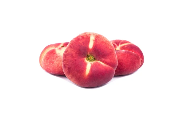 Three flat peaches — Stock Photo, Image