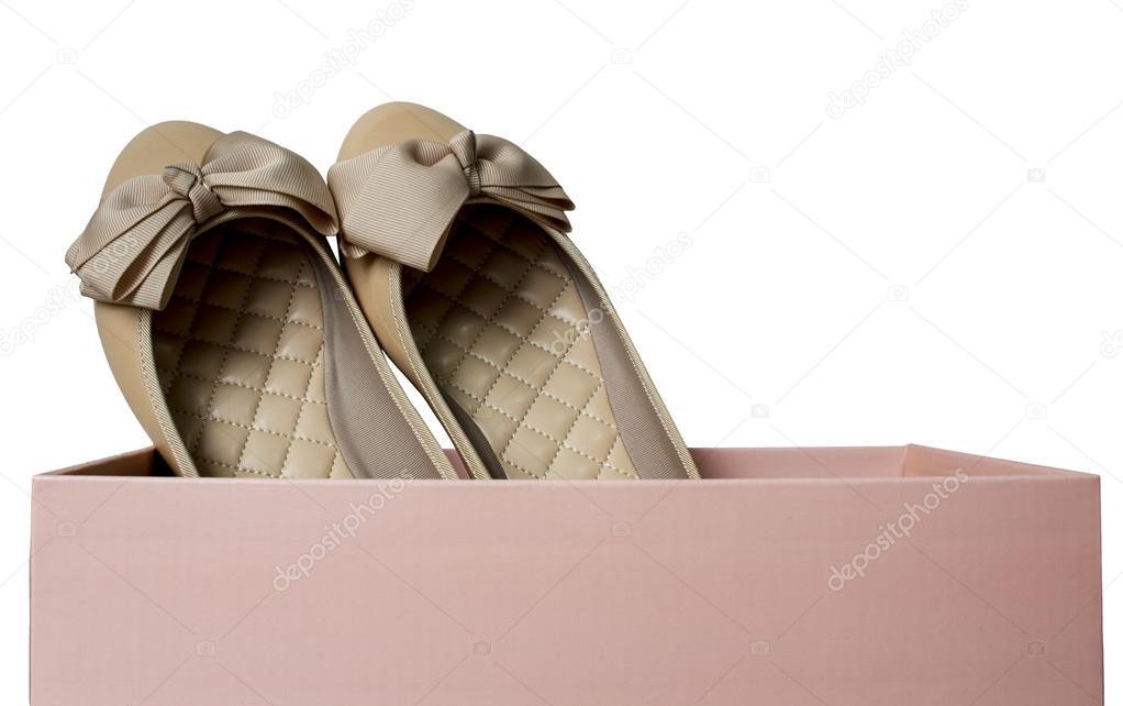 Light brown gloss summer and autumn flat shoes with pink box isolated on white