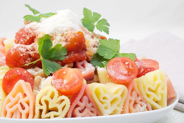 Colorful pasta with tomato sauce and cheese — Stock Photo, Image