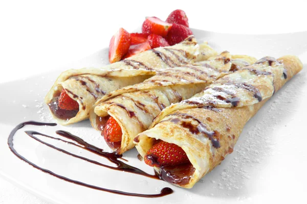 Sweet strawberry pancakes with chocolate — Stock Photo, Image