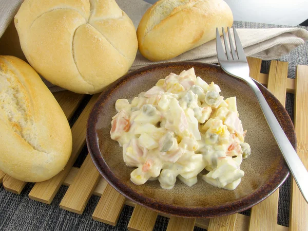 Traditional salad olivier with pea — Stock Photo, Image