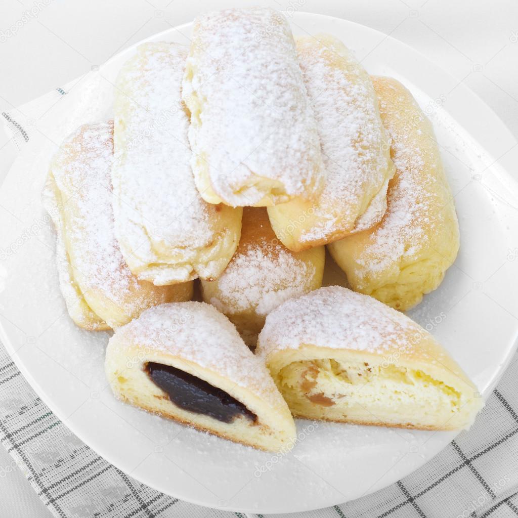 Traditional Slovak sweet yeast buns stuffed with plum jam and cottage cheese