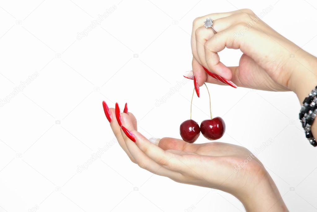 Two hands with cherries