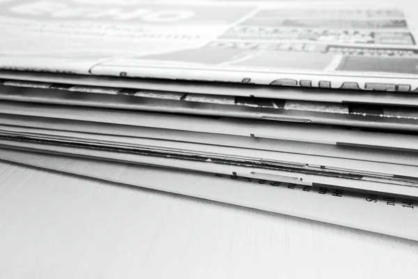 Newspaper on the wooden table — Stock Photo, Image