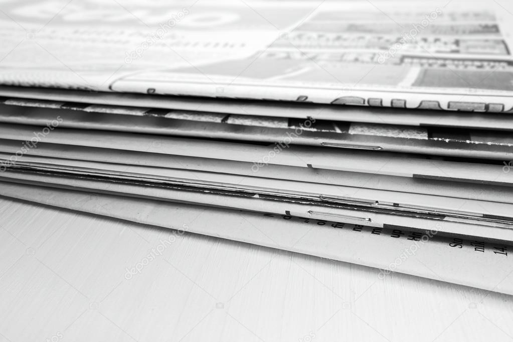 Newspaper on the wooden table