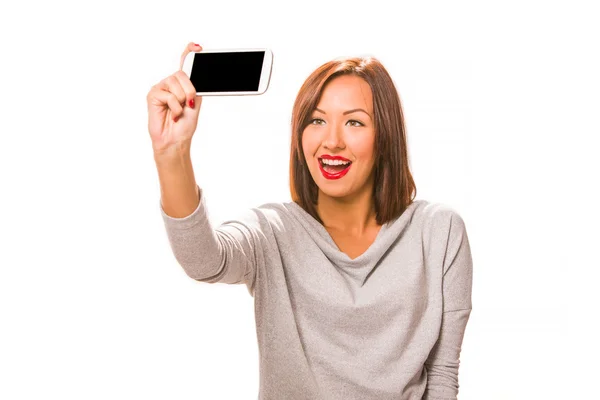 Beautiful young woman taking selfie using smartphone. — Stock Photo, Image