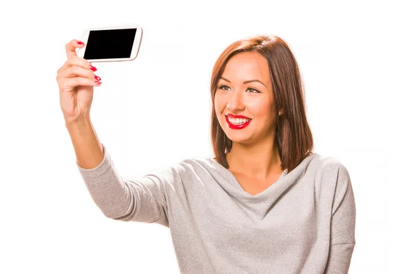 Beautiful young woman taking selfie using smartphone. — Stock Photo, Image