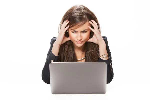 Young business woman working on laptop. Stock Image