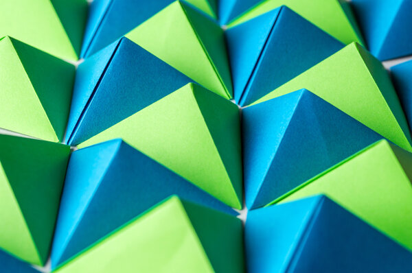 Origami tetrahedrons in blue, yellow and green colors.